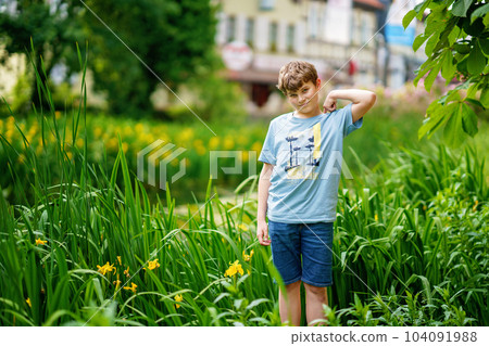 Portrait of positive preteen school kid boy. Beautiful happy child looking at the camera. Schoolboy smiling. Portrait of positive preteen school kid boy. Beautiful happy child looking at the camera. Schoolboy smiling. 104091988