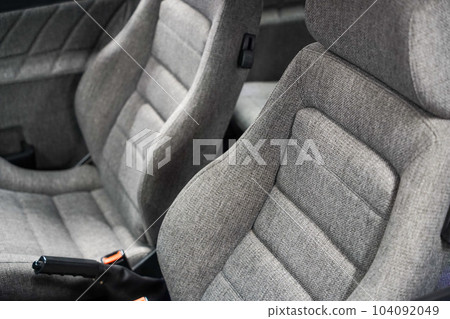 Classic renovated sport car seats in grey colour and natural premium wool material 104092049