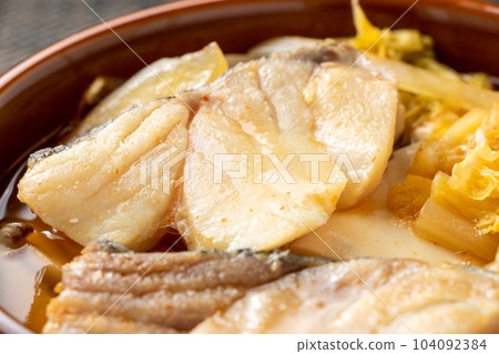 A close-up of a Korean-style hot pot of cod. A close-up of a Korean-style hot pot of cod. 104092384