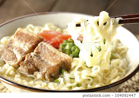 Eat Okinawa soba with pork ribs, plenty of small green onions and pickled ginger Eat Okinawa soba with pork ribs, plenty of small green onions and pickled ginger 104092447