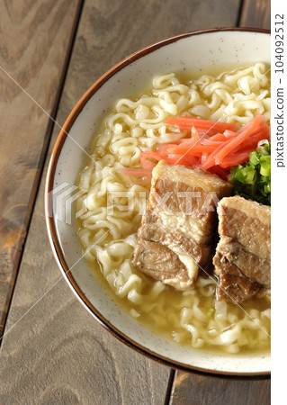 A bird's-eye view of Okinawa soba with pork ribs, plenty of small green onions, and pickled ginger 104092512