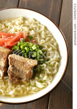 A bird's-eye view of Okinawa soba with pork ribs, plenty of small green onions, and pickled ginger 104092513