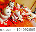 Interior with many beckoning cat figurines 104092605
