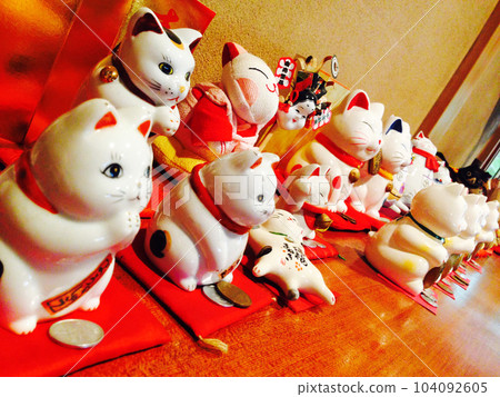Interior with many beckoning cat figurines Interior with many beckoning cat figurines 104092605