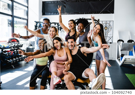 Happy diverse sportspeople having fun in fitness club together 104092740