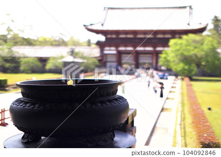 Nara, Todaiji Temple, the middle gate can be seen beyond the large incense burner in front of the Great Buddha Hall 104092846