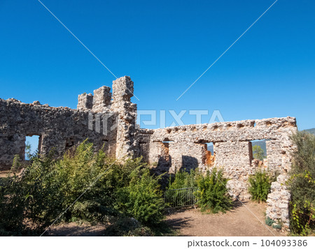 The ruins of Alanya old fortress with sharp, prickly outlines, weathered by time, stands under blue skies. The ruins of Alanya old fortress with sharp, prickly outlines, weathered by time, stands under blue skies. 104093386