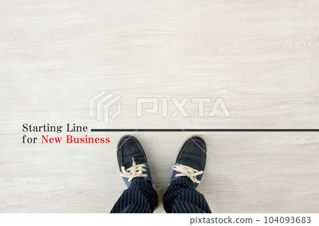 A man standing at the starting line of a new business 104093683