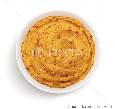 Spicy chili pepper butter isolated on white background, top view Spicy chili pepper butter isolated on white background, top view 104093921