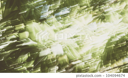 Abstract Nature Blurred dynamic motion lines defocused light bright dark green yellow tropical leaves Wallpaper screensaver design background 104094674