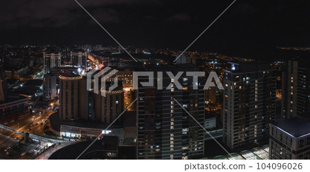 Aerial view of the Istambul business district. Rapidly developing business and finance area of Istanbul with highrises and shopping malls. Commercial buildings at night 104096026