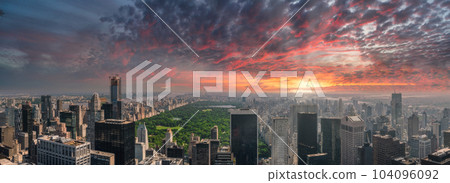 Beautiful sunset over Manhattan island in New York city. Aerial New York view from above. 104096092
