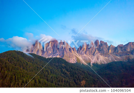 Rocky peaks of Dolomites Alps on Pass Giau at sunrise. Rocky peaks of Dolomites Alps on Pass Giau at sunrise. 104096504