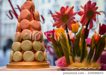 Wedding decoration with pastel colored cupcakes, meringues, muffins and macarons. Elegant and luxurious event arrangement with colorful macaroons. Wedding dessert with macaroons Wedding decoration with pastel colored cupcakes, meringues, muffins and macarons. Elegant and luxurious event arrangement with colorful macaroons. Wedding dessert with macaroons 104096643