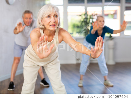 Elderly lady is engaged in modern dance class Elderly lady is engaged in modern dance class 104097494