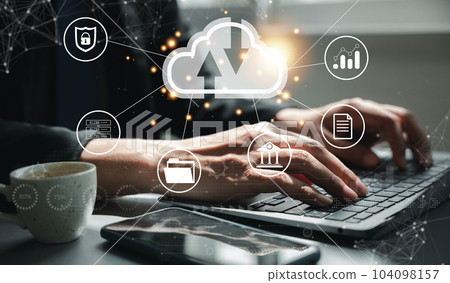 Virtual screen with cloud computing diagram in the hands of a man. Data storage, networking, and internet service concept. Laptop and network server in the background symbolize computer technology. Virtual screen with cloud computing diagram in the hands of a man. Data storage, networking, and internet service concept. Laptop and network server in the background symbolize computer technology. 104098157