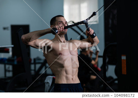 Man Thrust of the upper block to the chest in the gym. Man Thrust of the upper block to the chest in the gym. 104098172