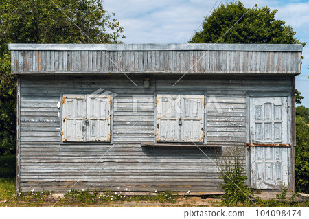 Closed old wooden kiosk in the village Closed old wooden kiosk in the village 104098474