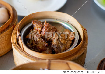 dim sum in bamboo steamer, chinese cuisine dim sum in bamboo steamer, chinese cuisine 104098549