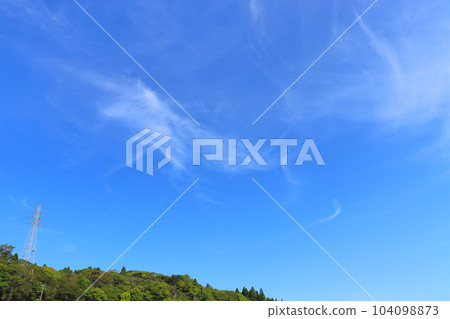Blue sky, thin clouds, forest, steel tower Blue sky, thin clouds, forest, steel tower 104098873