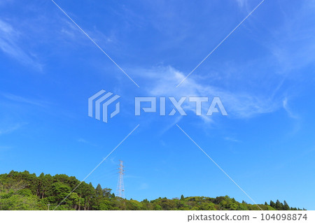 Blue sky, thin clouds, forest, steel tower Blue sky, thin clouds, forest, steel tower 104098874