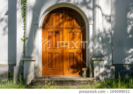 A wooden door at a small chapel, Czechia. A wooden door at a small chapel, Czechia. 104099052