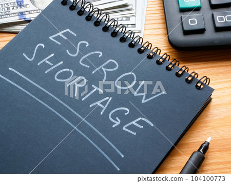 The entry Escrow shortage was made in a notebook with a white marker. The entry Escrow shortage was made in a notebook with a white marker. 104100773