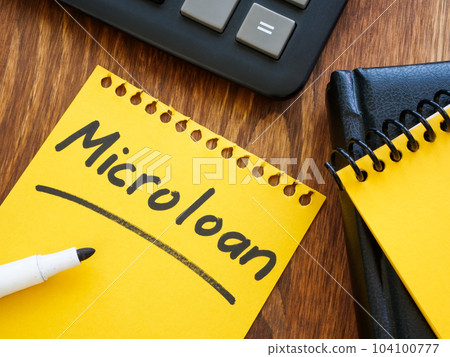 Notebook with entry about microloan and calculator. Notebook with entry about microloan and calculator. 104100777