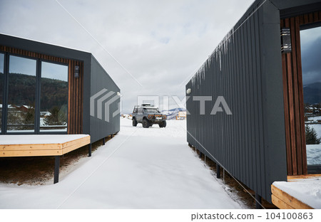 Wooden two small houses in Scandinavian modern style offroad car. Exterior. Wooden two small houses in Scandinavian modern style offroad car. Exterior. 104100863