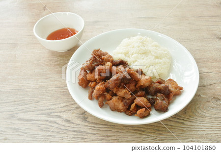 fried salty pork eat with sticky rice on dish dipping spicy chili sauce 104101860