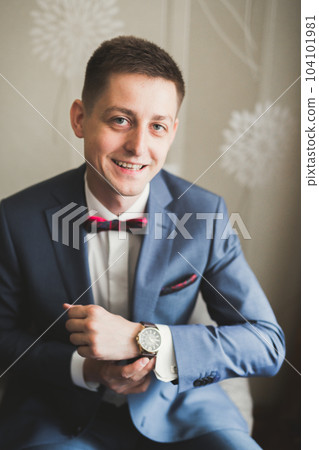 Beautiful man, groom posing and preparing for wedding Beautiful man, groom posing and preparing for wedding 104101981
