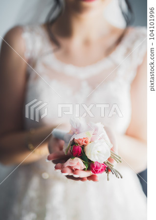 Portrait of beautiful bride with fashion veil at wedding morning 104101996