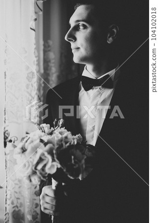 Beautiful man, groom posing and preparing for wedding 104102018