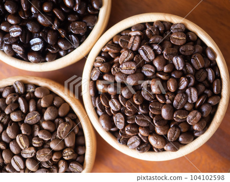 brown arabica coffee bean roast 3 level medium to dark different taste seed caffeine espresso drink food cafe beverage Chiang Rai, Thailand coffee on wooden table background top view selected focus brown arabica coffee bean roast 3 level medium to dark different taste seed caffeine espresso drink food cafe beverage Chiang Rai, Thailand coffee on wooden table background top view selected focus 104102598