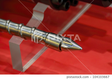 Close up scene  the end of injection machine screw spare parts. Close up scene  the end of injection machine screw spare parts. 104103667
