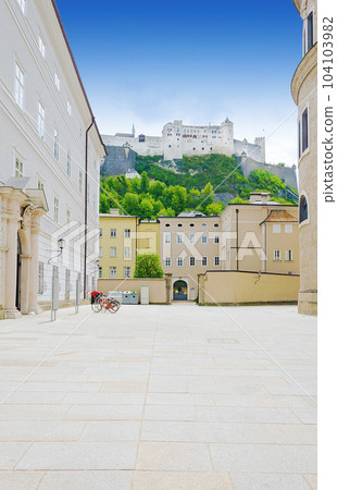 Hohensalzburg Fortress in Salzburg city in Austria, as seen from the Residence Square (Residenzplatz), in the old town and historic centre. Large medieval fortress atop a hill called the Festungsberg. 104103982