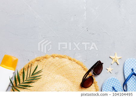 Summer vacation concept flat lay. straw hat beach accessories and towel top view. Space for text. travel concept 104104495