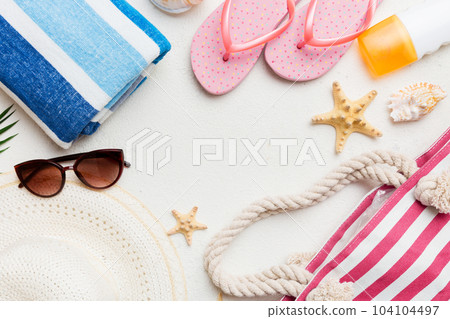 Summer vacation concept flat lay. beach accessories and towel top view. Space for text. travel concept Summer vacation concept flat lay. beach accessories and towel top view. Space for text. travel concept 104104497
