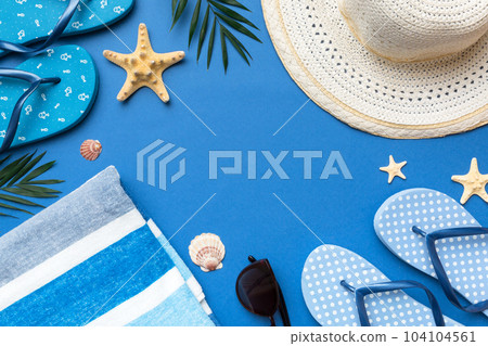 Summer vacation concept flat lay. straw hat beach accessories and towel top view. Space for text. travel concept 104104561