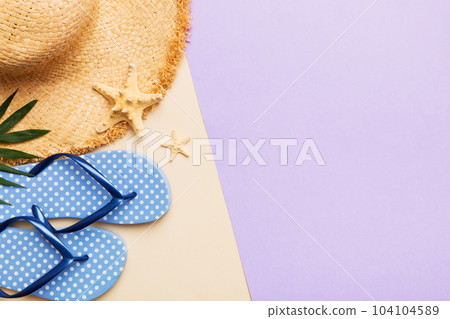 Summer vacation concept flat lay. straw hat beach accessories and flip flop top view. Space for text. travel concept Summer vacation concept flat lay. straw hat beach accessories and flip flop top view. Space for text. travel concept 104104589