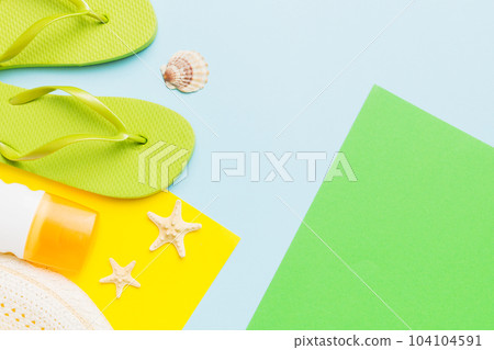 Summer vacation concept flat lay. straw hat beach accessories and flip flop top view. Space for text. travel concept Summer vacation concept flat lay. straw hat beach accessories and flip flop top view. Space for text. travel concept 104104591