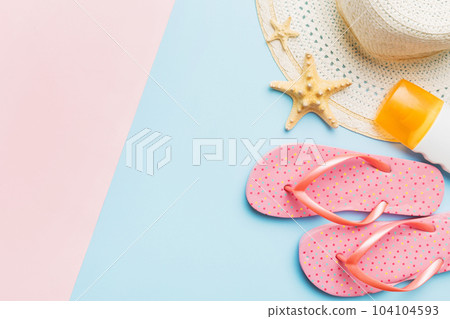 Summer vacation concept flat lay. straw hat beach accessories and flip flop top view. Space for text. travel concept 104104593