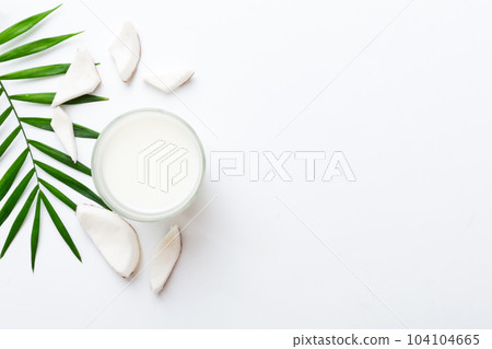 coconut products on white wooden table background. Dairy free milk substitute drink, Flat lay healthy eating 104104665