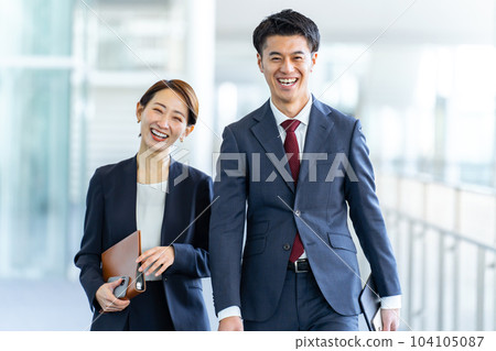 Business walking men and women Business walking men and women 104105087