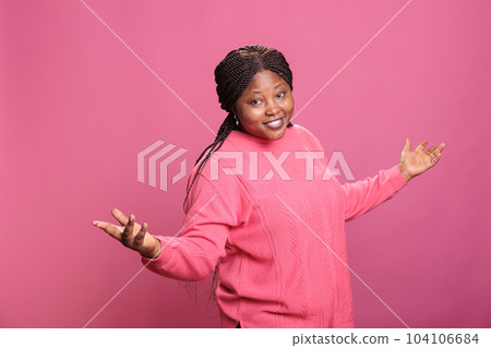 Confident female model having surprised emotions, having fun in studio and feeling happy or relaxed in front of camera. Young woman having optimistic energy and showing funky amusing reaction. Confident female model having surprised emotions, having fun in studio and feeling happy or relaxed in front of camera. Young woman having optimistic energy and showing funky amusing reaction. 104106684