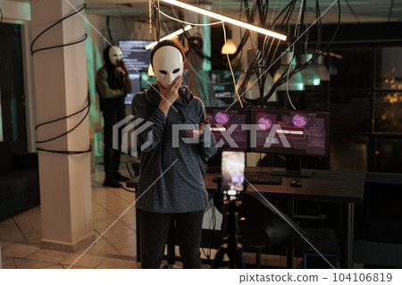 Cybercrime, thief recording video, asking money for ransom, anonymous threatening on smartphone camera, hacker stealing banking information. Online scam, criminal calling victim 104106819