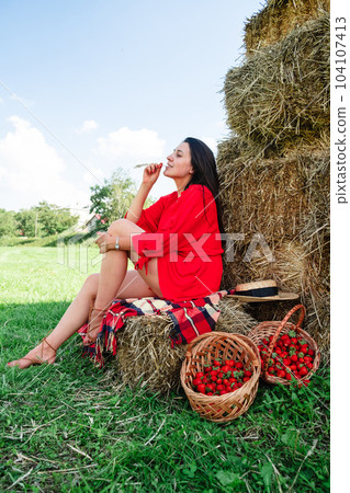 Portrait of Smiling Woman with Basket of Strawberries Portrait of Smiling Woman with Basket of Strawberries 104107413