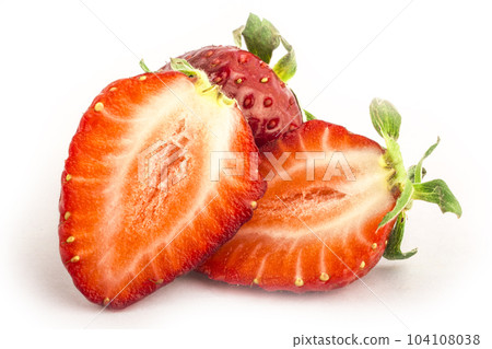 Isolated red strawberries. Three fruits, one cut in half on a white background 104108038