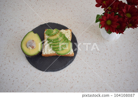 Healthy breakfast toast with avocado, ricotta and herbs Healthy breakfast toast with avocado, ricotta and herbs 104108087