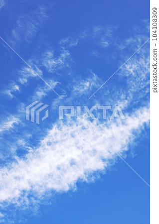White cirrus clouds in the blue sky White cirrus clouds in the blue sky 104108309